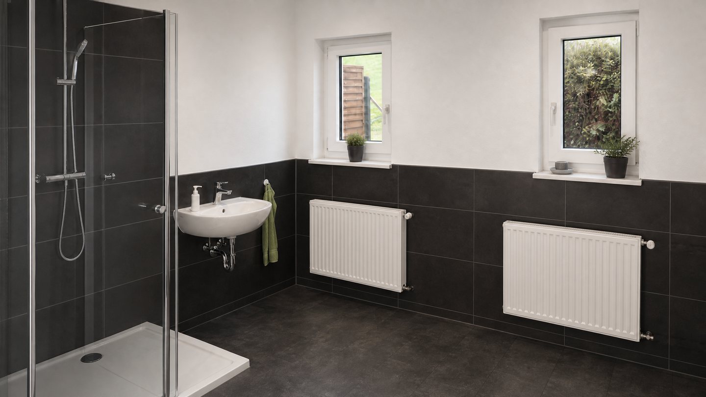 Badezimmer nach der Renovierung, dunkel geflieste W&auml;nde und ebenerdige Dusche